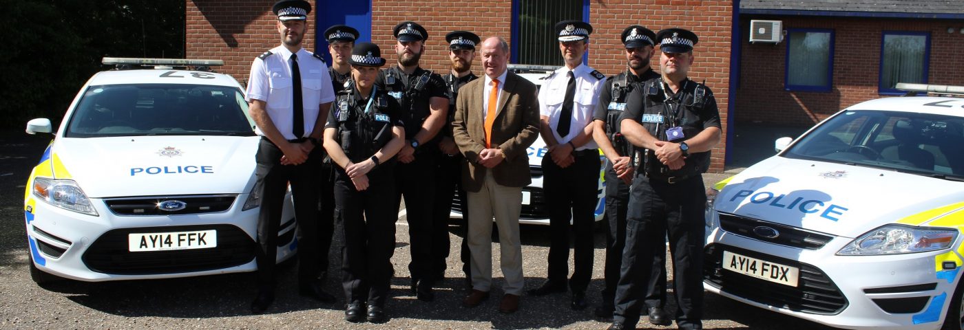 PCC and Chief Constable with the Sentinel team officers and police cars