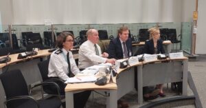 PCC at a panel meeting seated with the Chief Constable and the Chief Executive and Chief Finance Officer